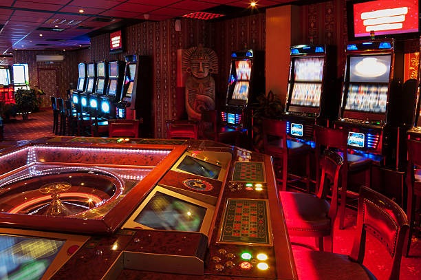 Live dealer dealing cards at baccarat table